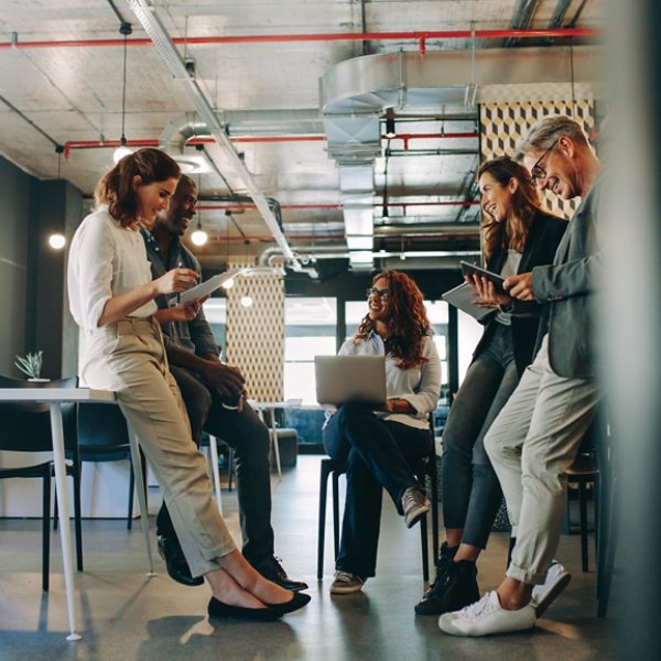 Employees meeting in a modern office. Group of multi-ethnic business people having a meeting at startup office.