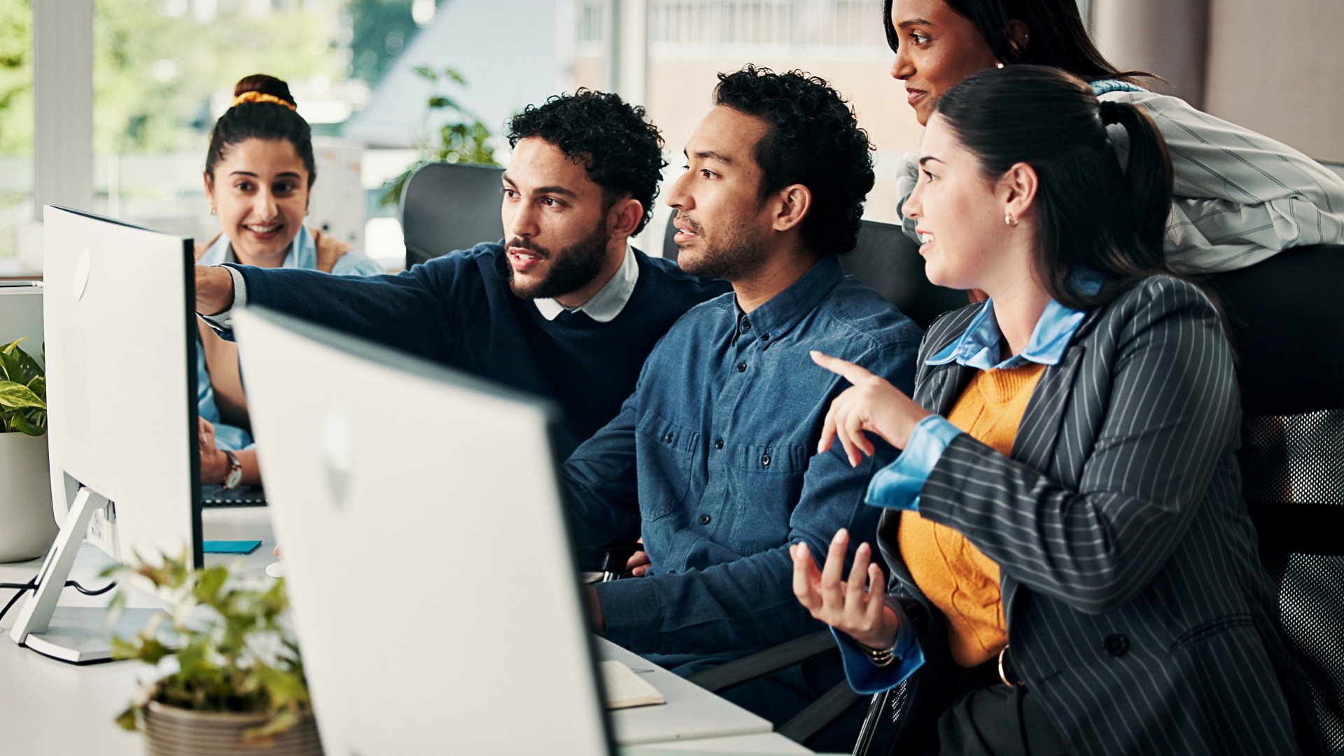 Business, mentor and team with advice on computer for training, article guidance or story feedback. People, creative interns and help with tech at coworking agency for news reporting and editing FAQ.