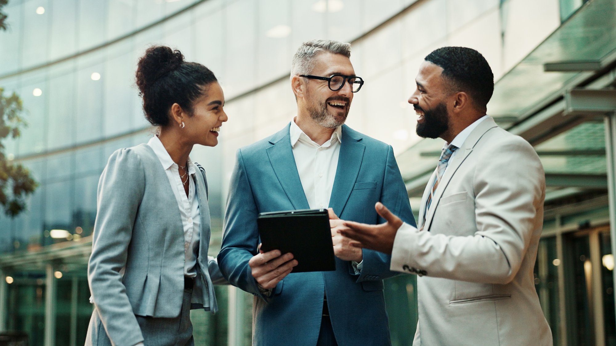 Business, people and happy in outdoor with tablet in city for financial report, update and feedback in New York. Downtown, employees and smile as accountants with teamwork, collaboration and plan.