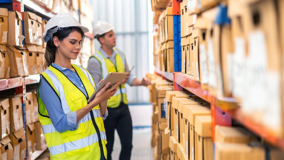 Engineer team cargo shipping order on laptop export and import, goods, factory ,warehouse ,international trade ,transportation ,cargo ship ,logistic, distribution at logistics center.business industry