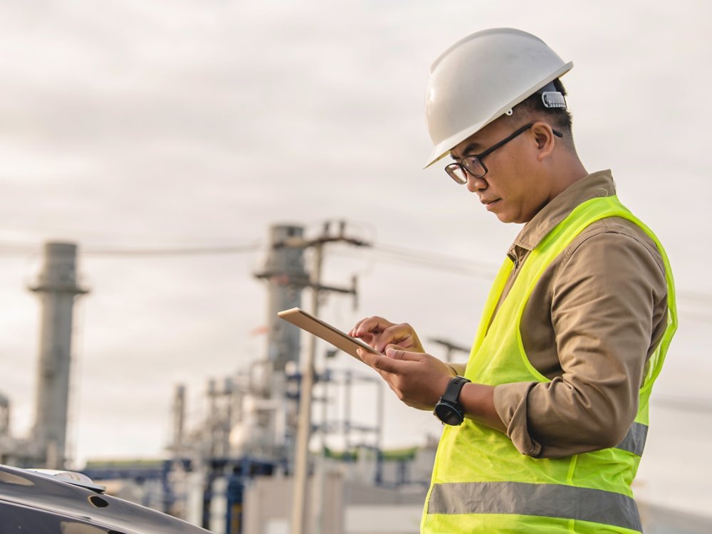 Asian man petrochemical engineer working at oil and gas refinery plant industry factory,The people worker man engineer work control at power plant energy industry manufacturing