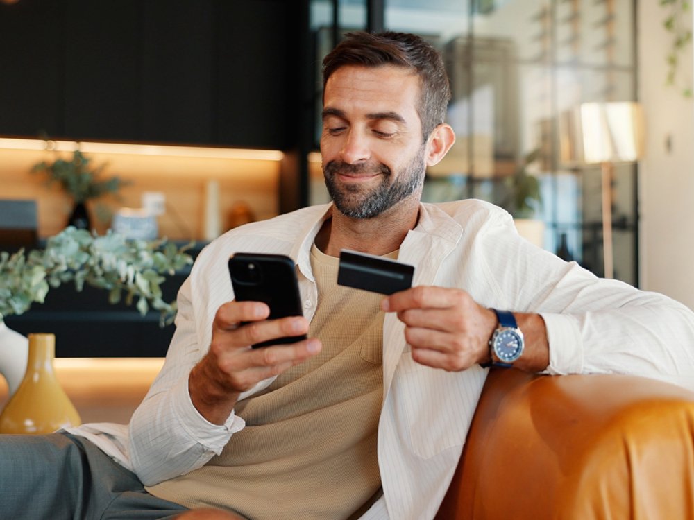 man banking by phone