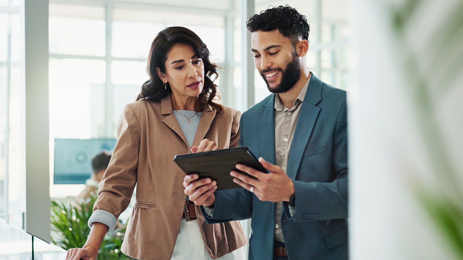 Tablet, meeting and business people in office with research for break in finance stock market. Discussion, digital technology and financial advisors with online revenue, profit or equity report