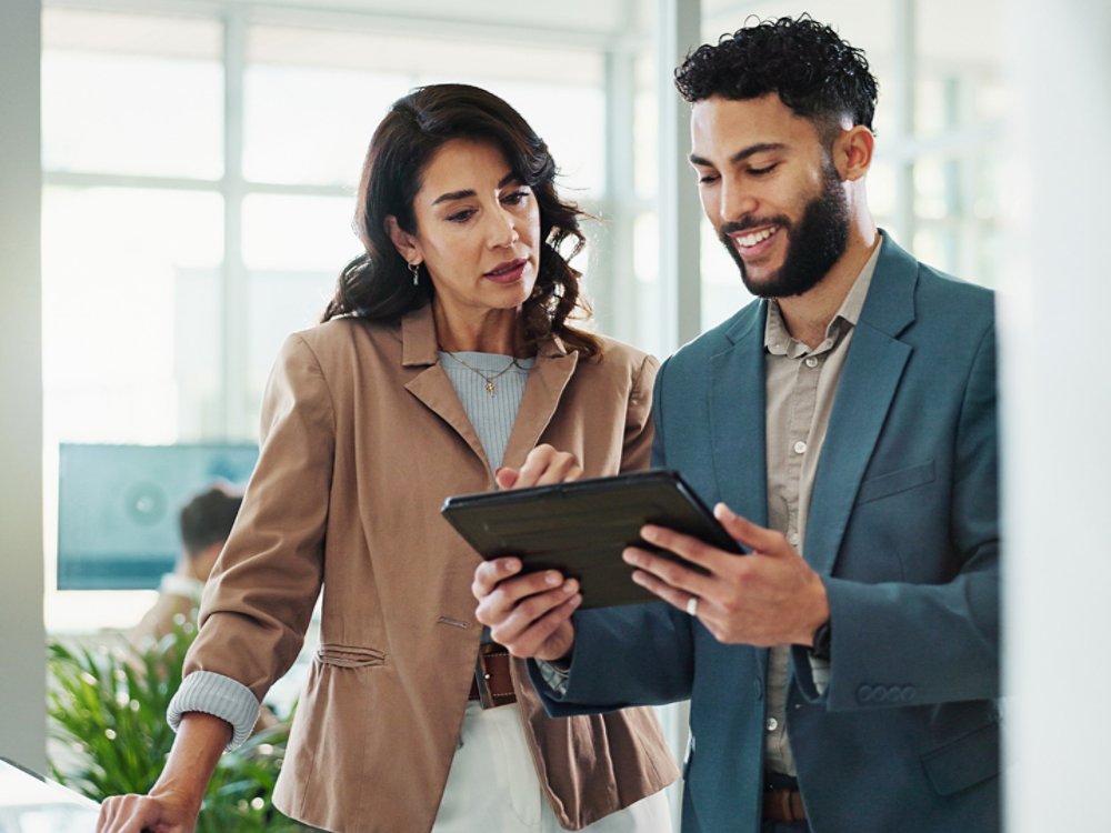 Tablet, meeting and business people in office with research for break in finance stock market. Discussion, digital technology and financial advisors with online revenue, profit or equity report