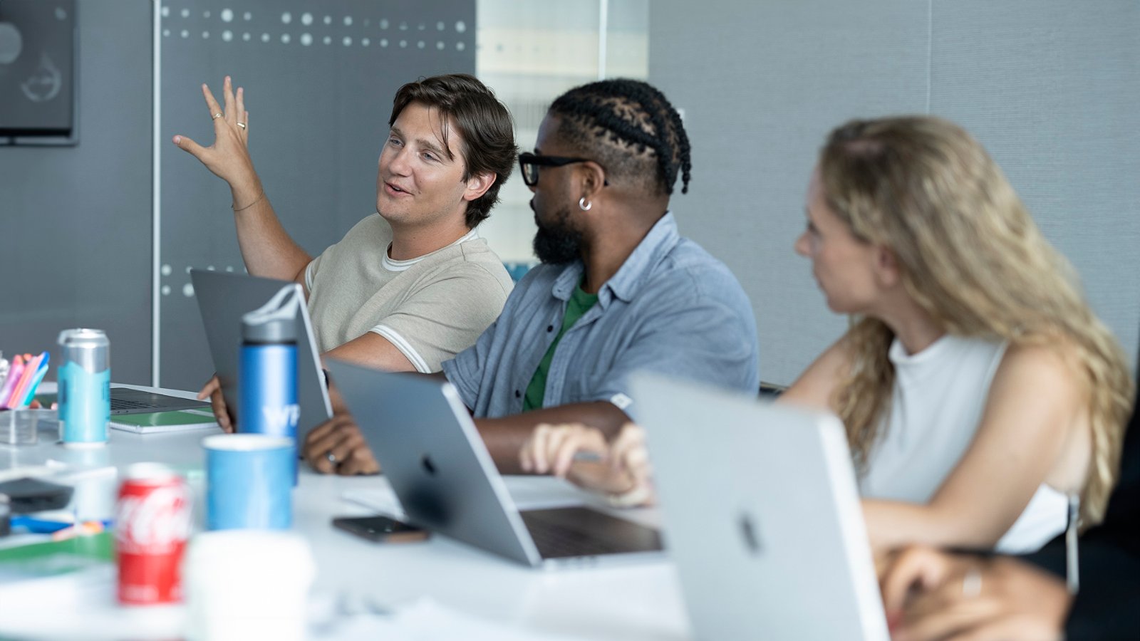 man explaining in team meeting