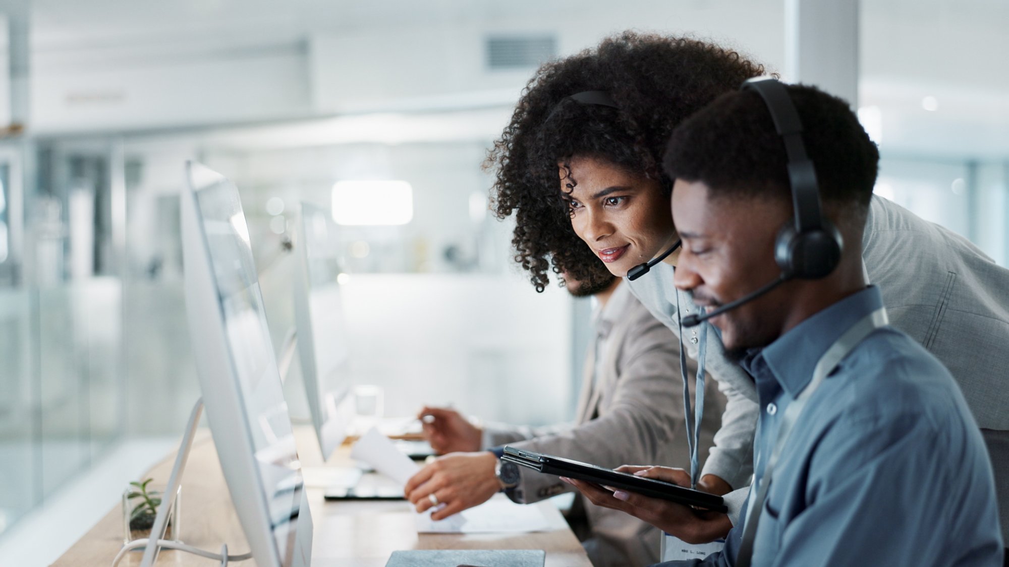Call center computer, happy mentor and people for telemarketing sales, outsourcing or check onboarding progress. Technical support data, help desk teamwork and manager consulting agent on CRM info.