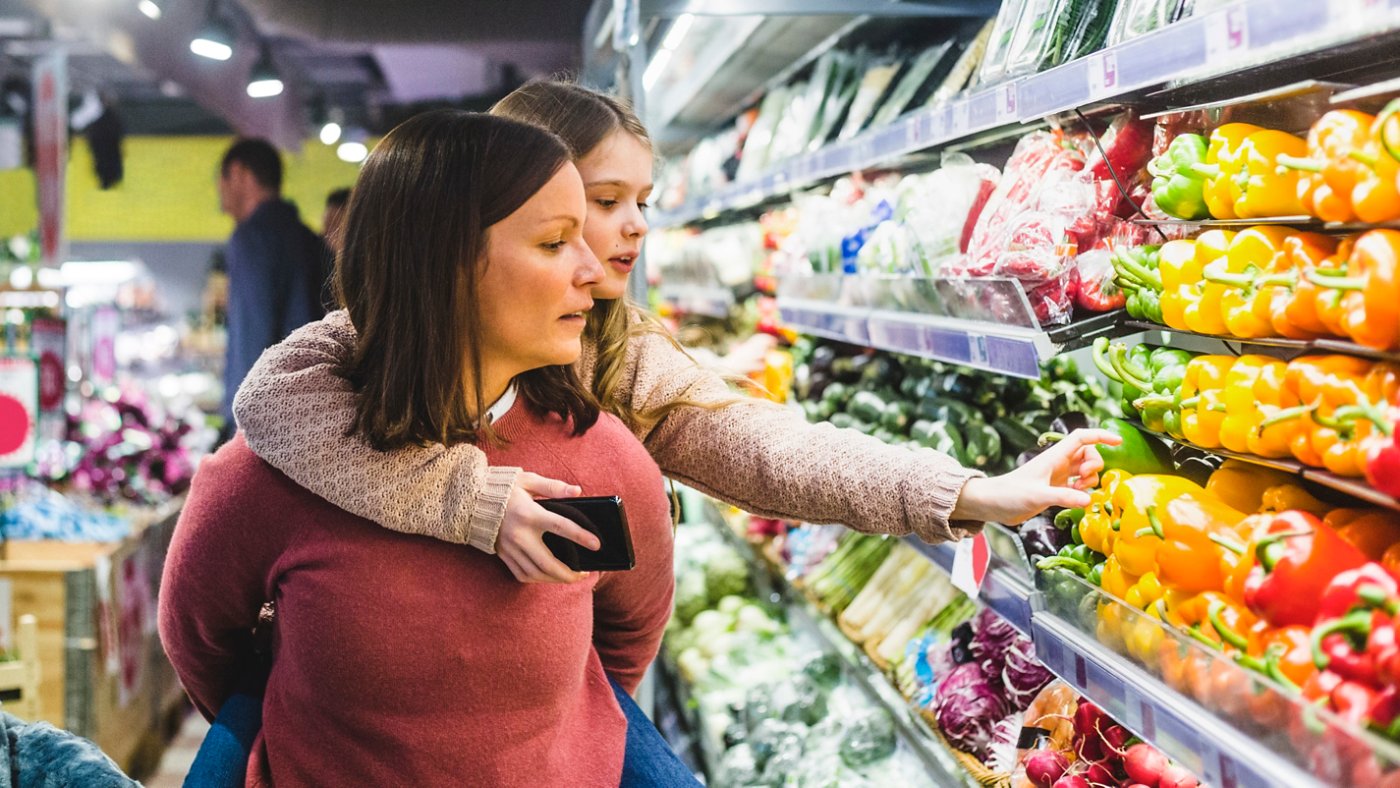 mother and daughter shopping for fresh produce