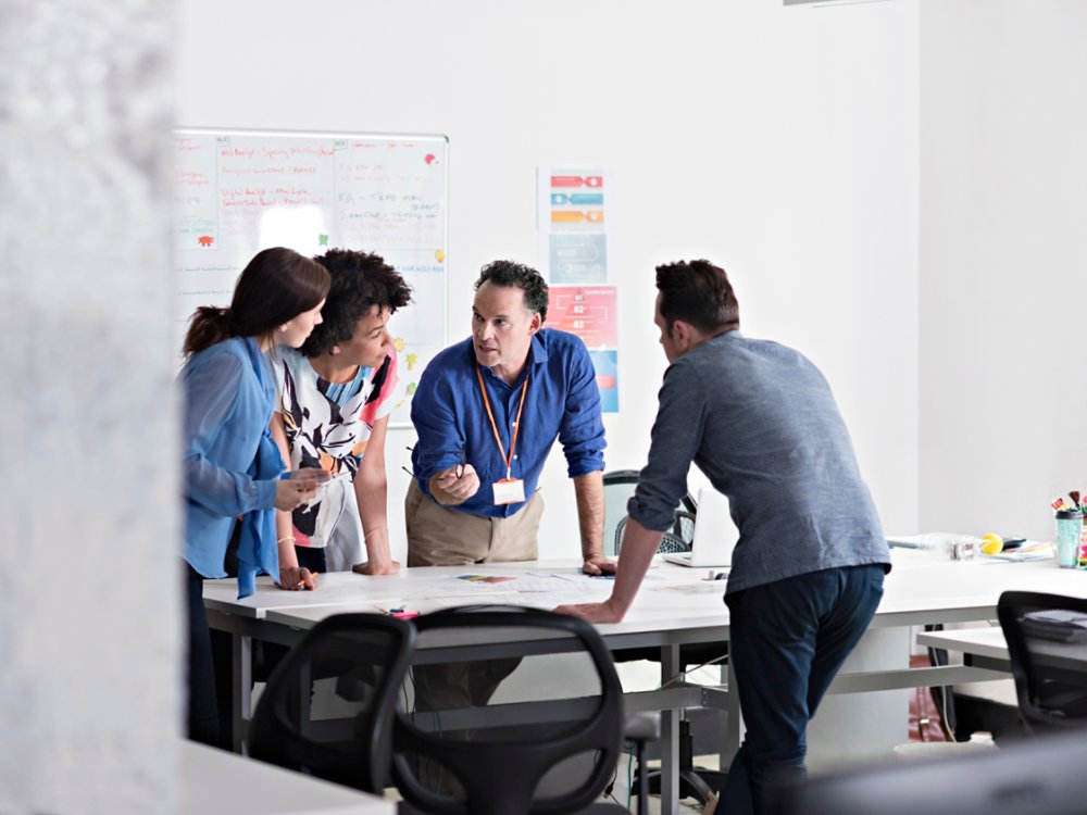 Business people having meeting in tech start-up office