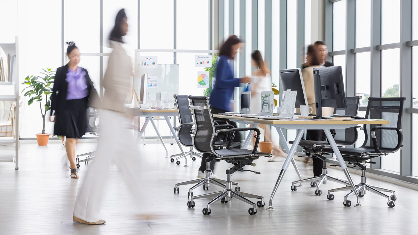 Blurry office business women walking in rush