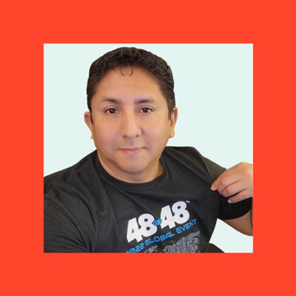 Young hispanic volunteer is showing his t-shirt