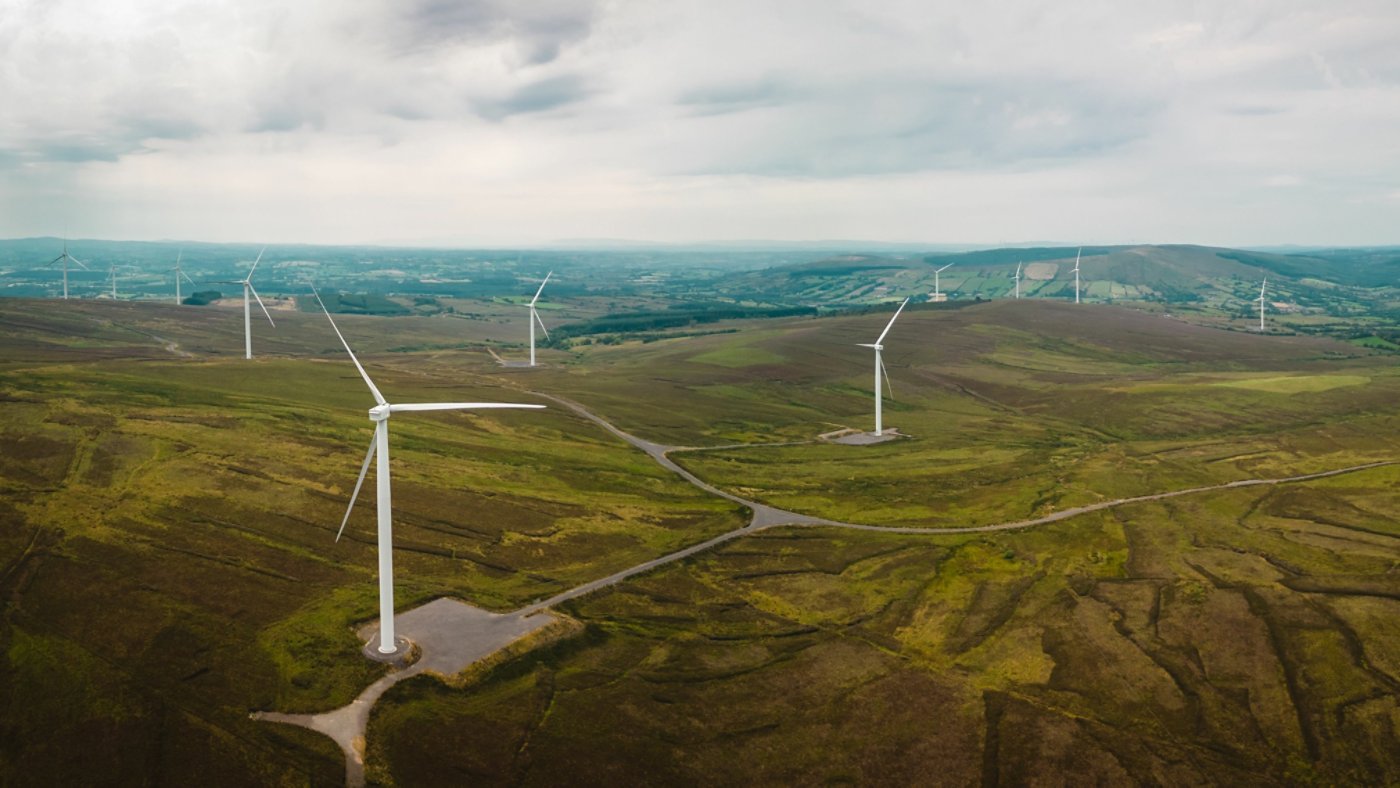 Panorama of rural landscape with a farm of wind turbines, Ireland