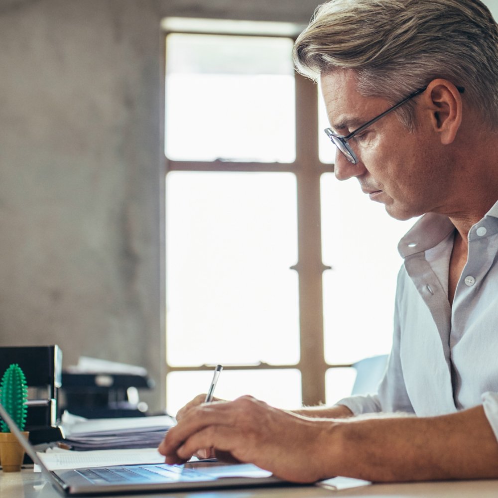Businessman working at his desk on laptop