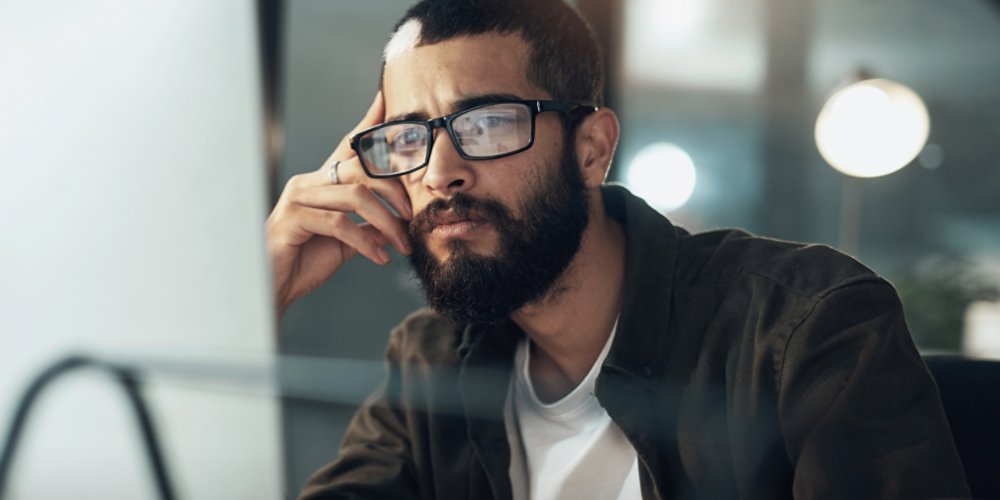 Man looking at computer screen AdobeStock_493402959