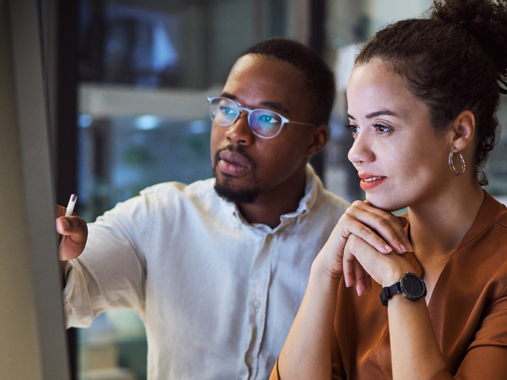 Man and woman working on computer