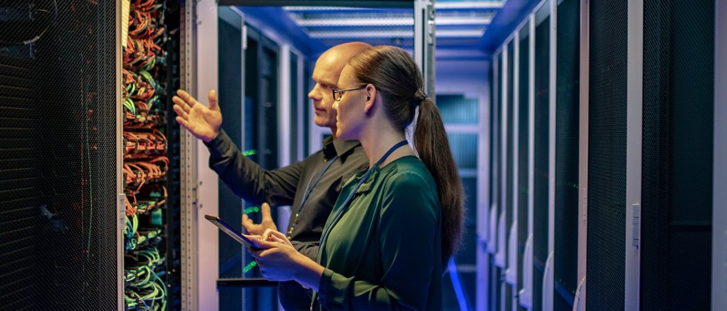 Man and woman working at a data center