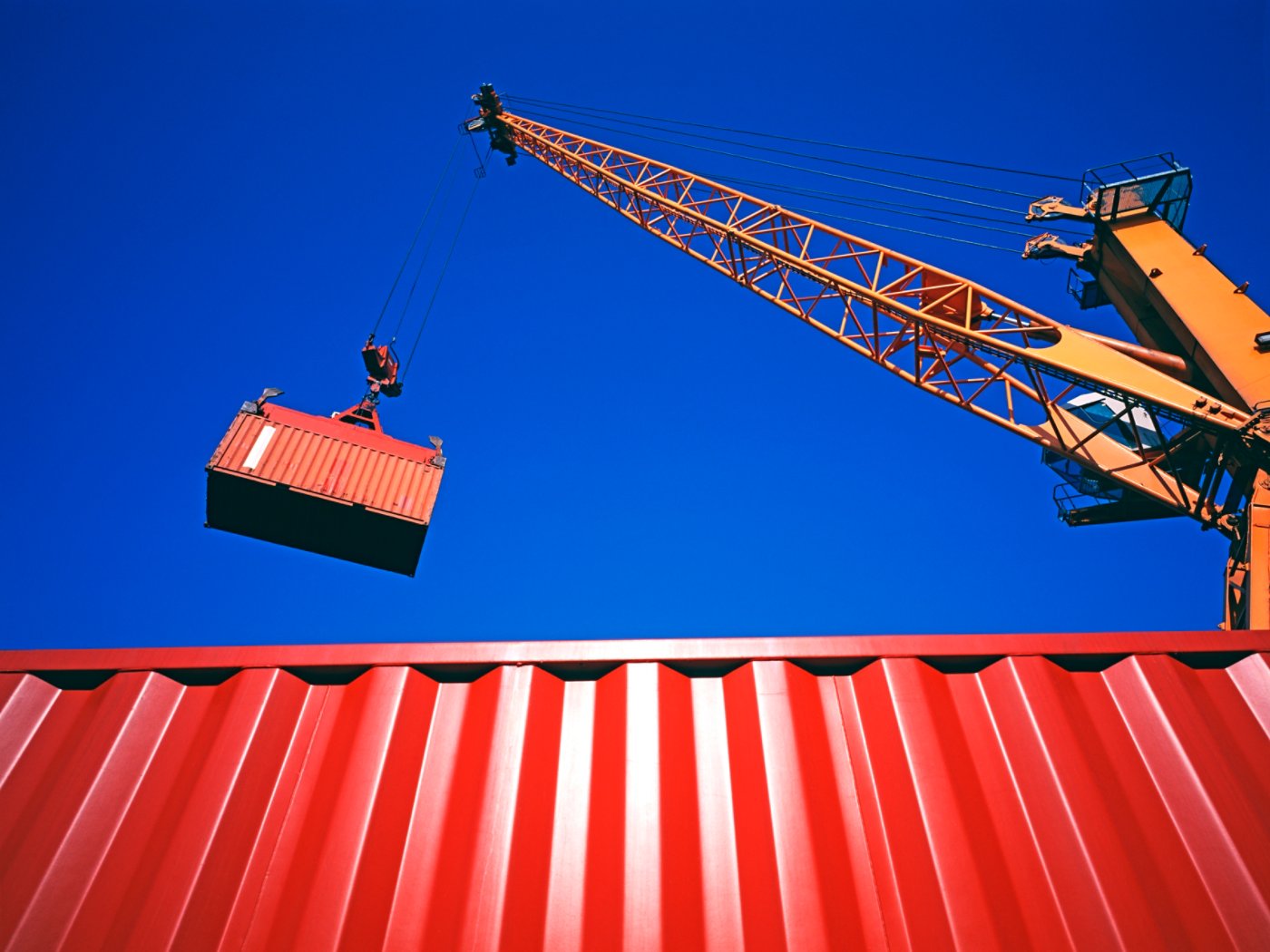 Crane lifting a cargo container at a freight terminal.  Istanbul, Turkey