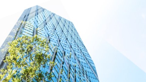 High rise building, skyscraper with sky and green, copy space Tokyo, Japan, at day time.