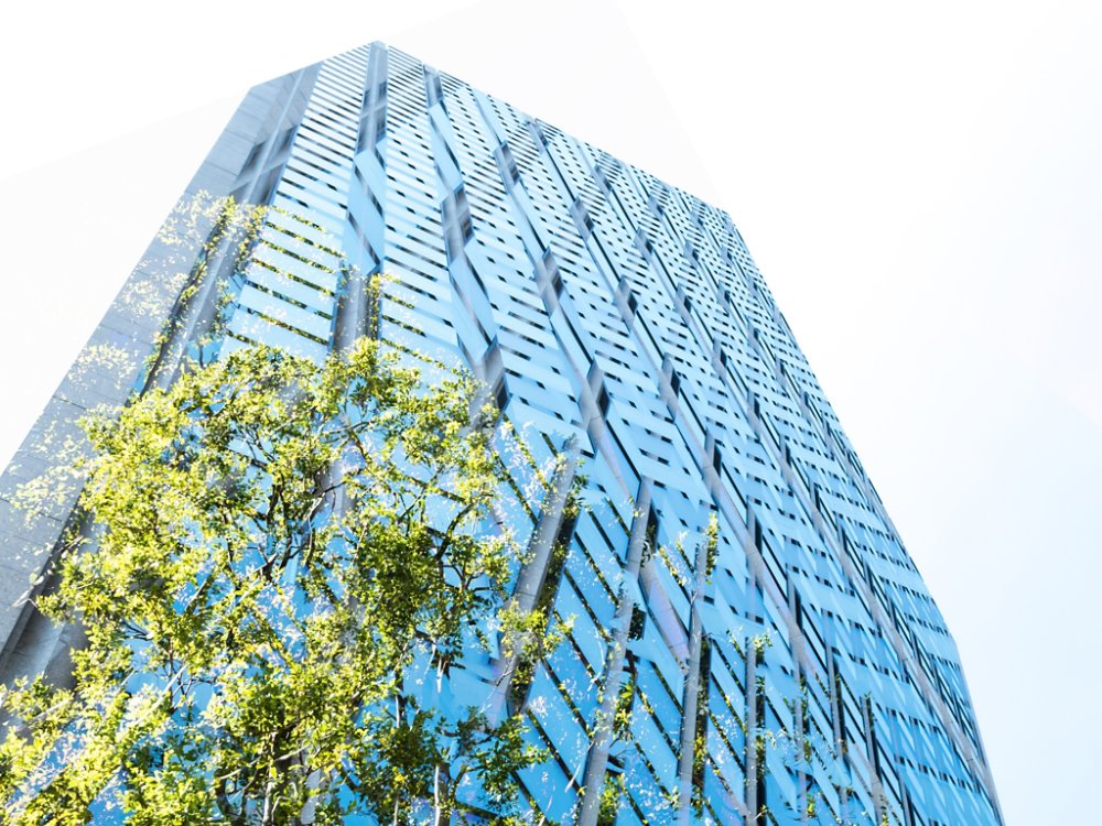 High rise building, skyscraper with sky and green, copy space Tokyo, Japan, at day time.