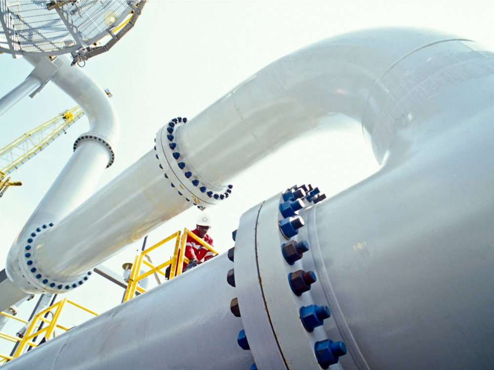 Worker on HP Separator, FPSO offshore, Angola. Floating Production Storage and Offloading units house both processing equipment and storage for produced hydrocarbons.