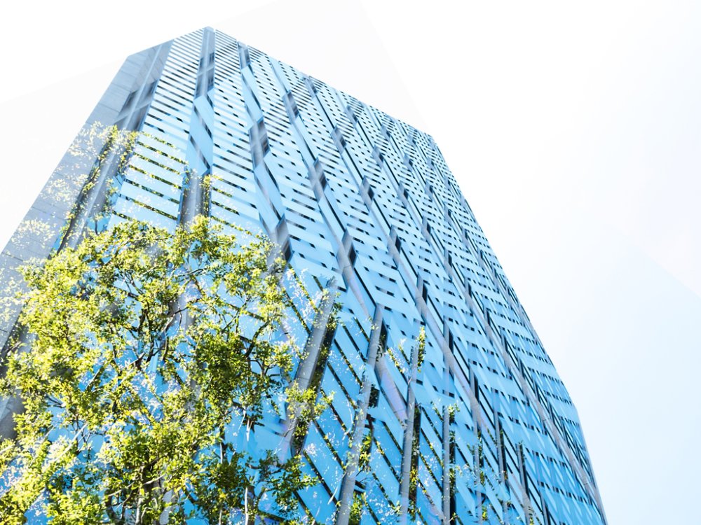 High rise building, skyscraper with sky and green, copy space Tokyo, Japan, at day time.