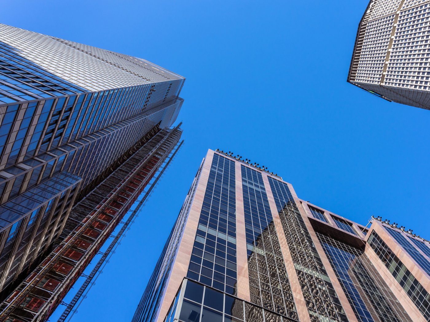 This view from Vanderbilt Avenue in Midtown Manhattan looks up at the tall office buildings along the avenue near Grand Central Terminal.  Among the buildings seen here are the under construction One Vanderbilt and the MetLife Building (formerly the PanAm Building).