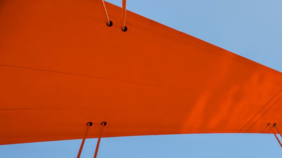 Closeup of red-orange bridge support beam