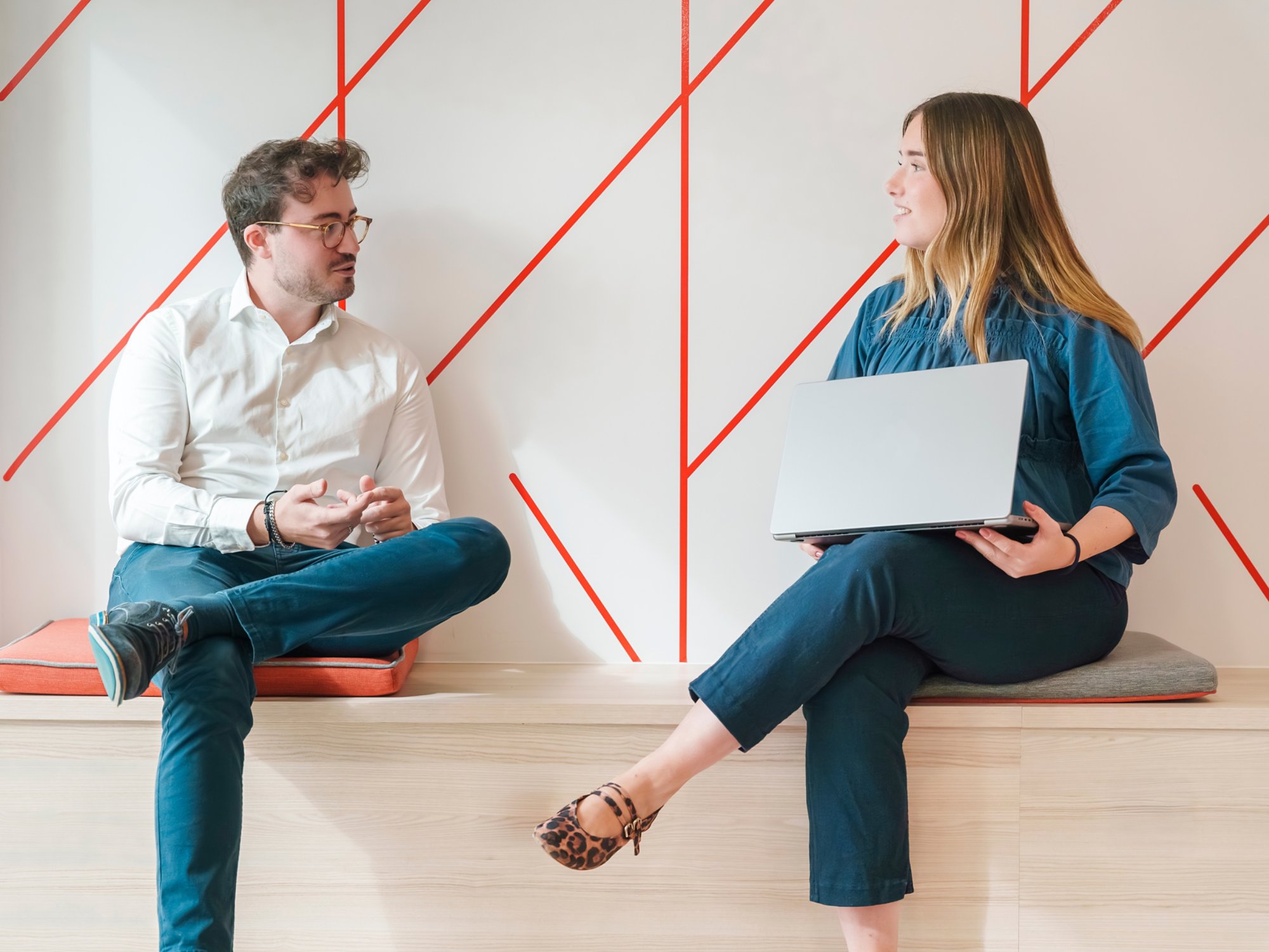 Two Kyndryl employees discussing a project in Madrid, Spain