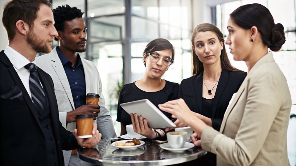 Business, people and communication with tablet in office for collaboration or partnership on company project for growth strategy. Team, diversity and digital technology for daily feedback or review