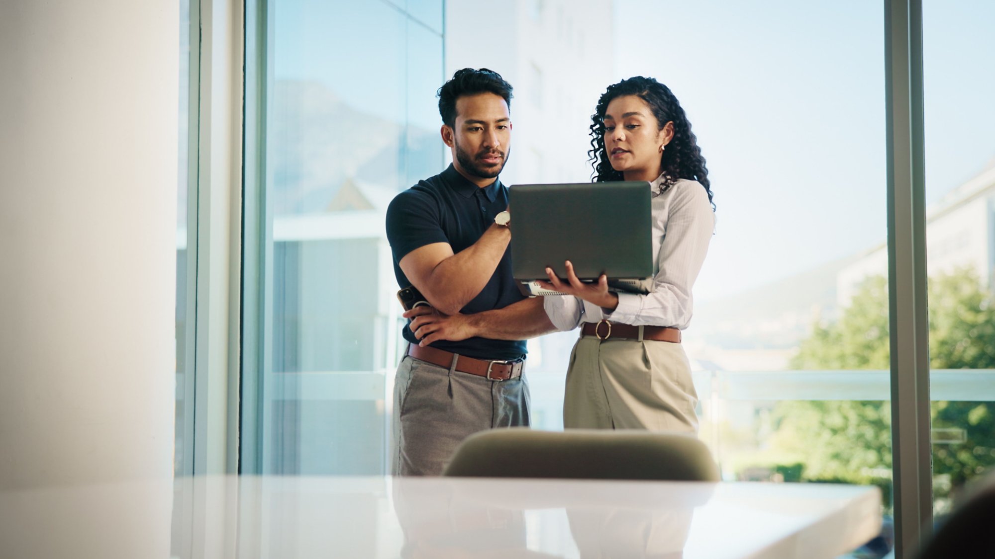 Business people, laptop and meeting with real estate team, discussion or available listings on website. Check, collaboration and property review for realtor group, strategy or client feedback on pc.