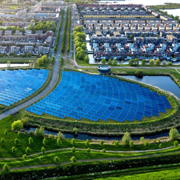 Modern sustainable neighbourhood in Almere, The Netherlands. The city heating (stadswarmte) in the district is partially powered by a solar panel island (Zoneiland). Aerial view.