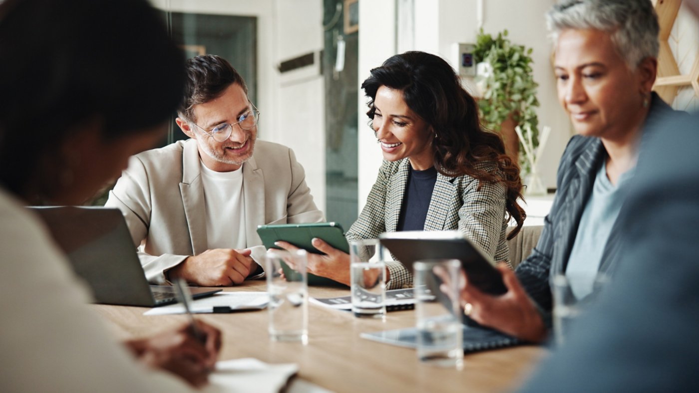 Meeting, technology and business people in office for finance investment with company with online. Collaboration, discussion and financial management team with profit or revenue margin report