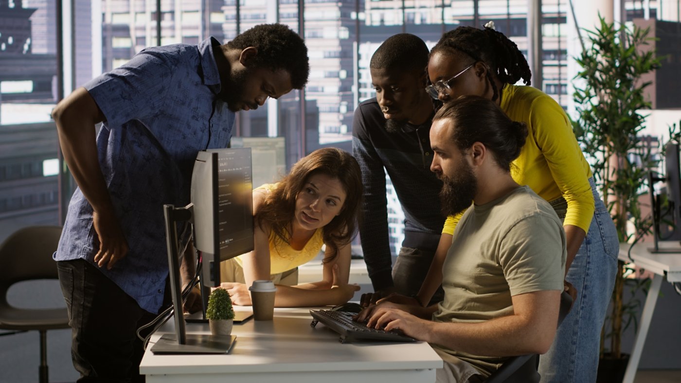 Programmers gathered together to conduct code review to fix errors, identifying technical issues with company software. Team of developers doing brainstorming, optimizing code, camera A