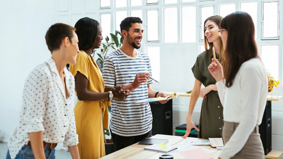 Multi ethnic coworking team at workplace in Barcelona 16X9