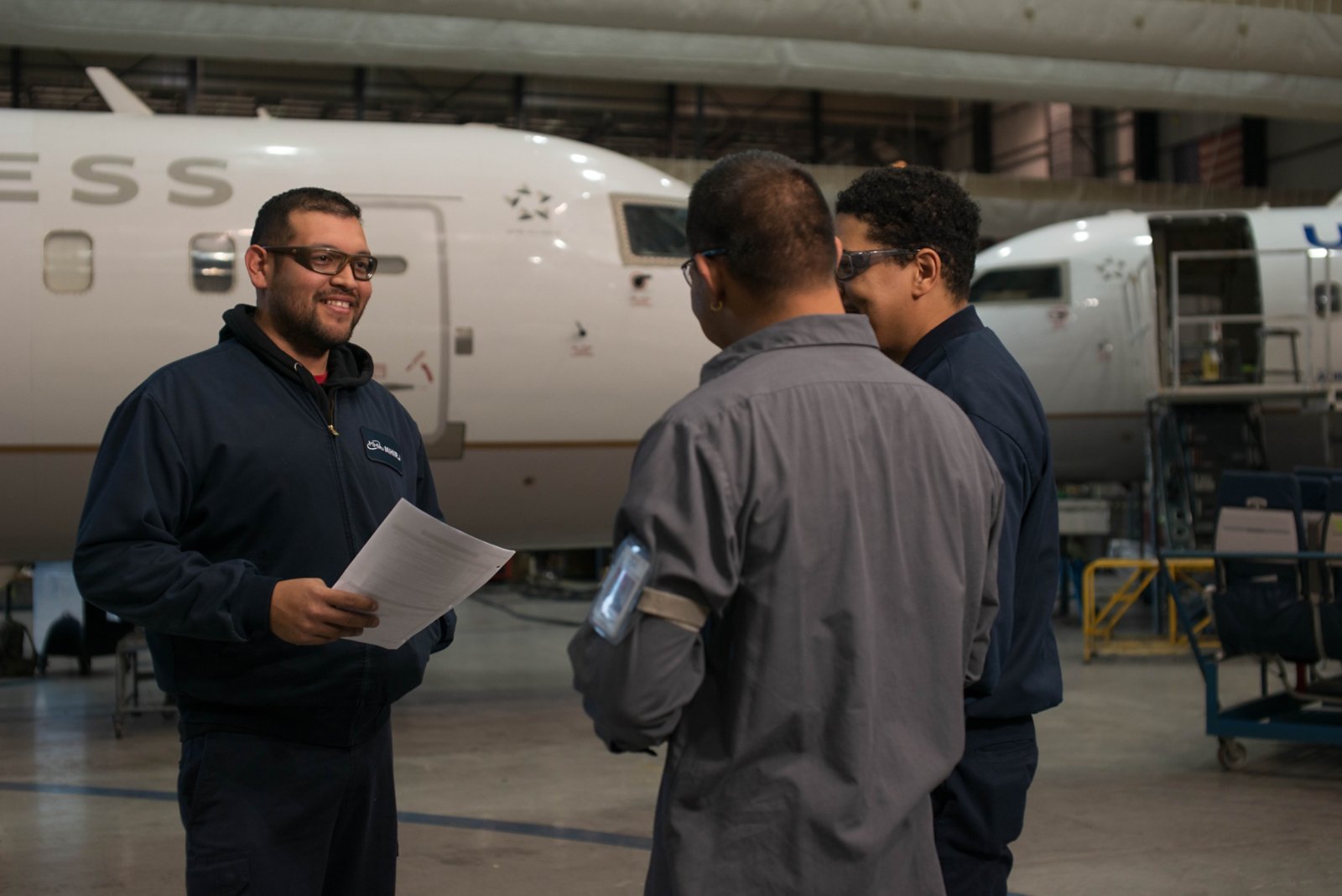 three workers talking