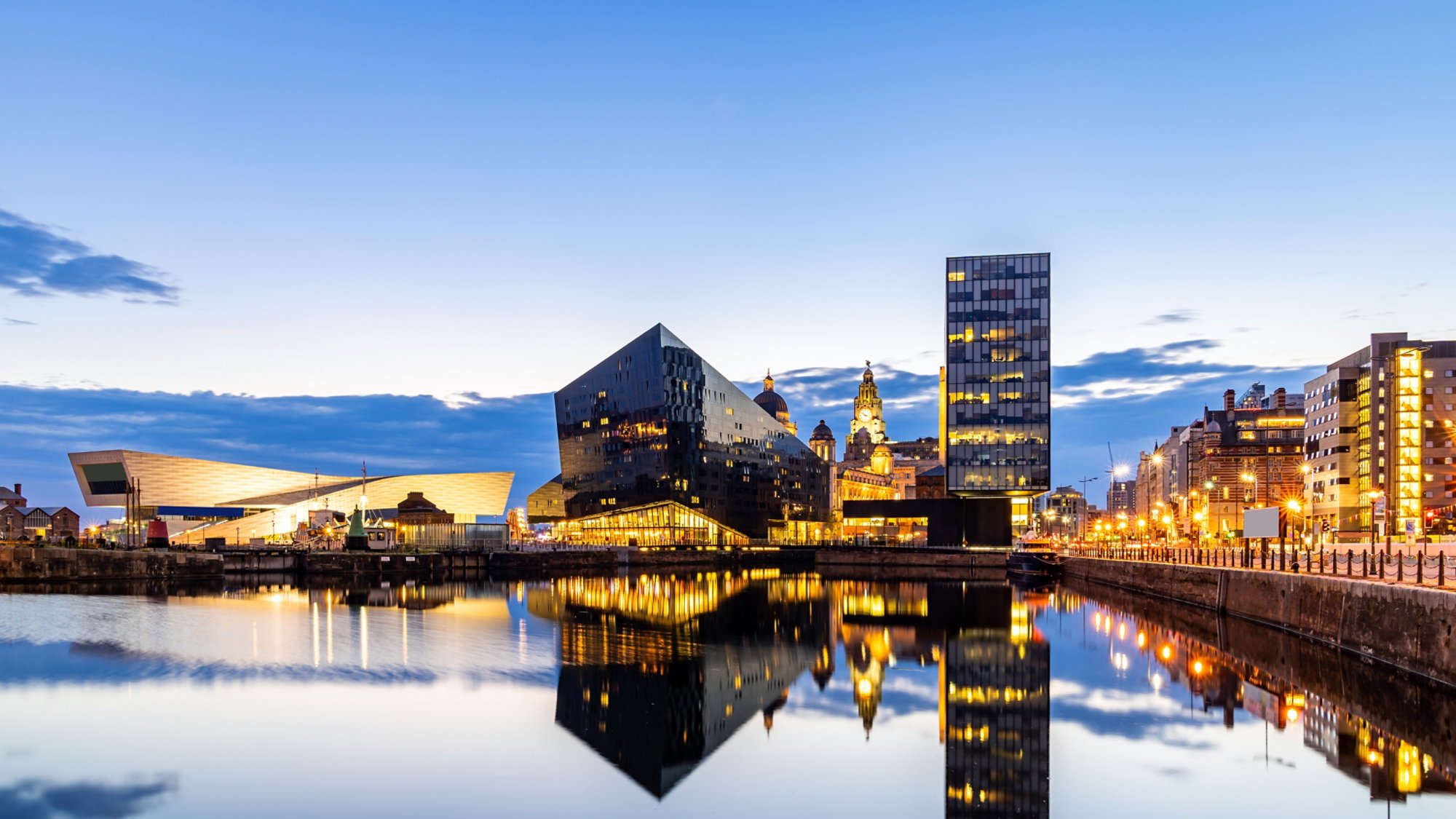 Liverpool Skyline building at Pier head and alber dock at sunset dusk, Liverpool England UK.