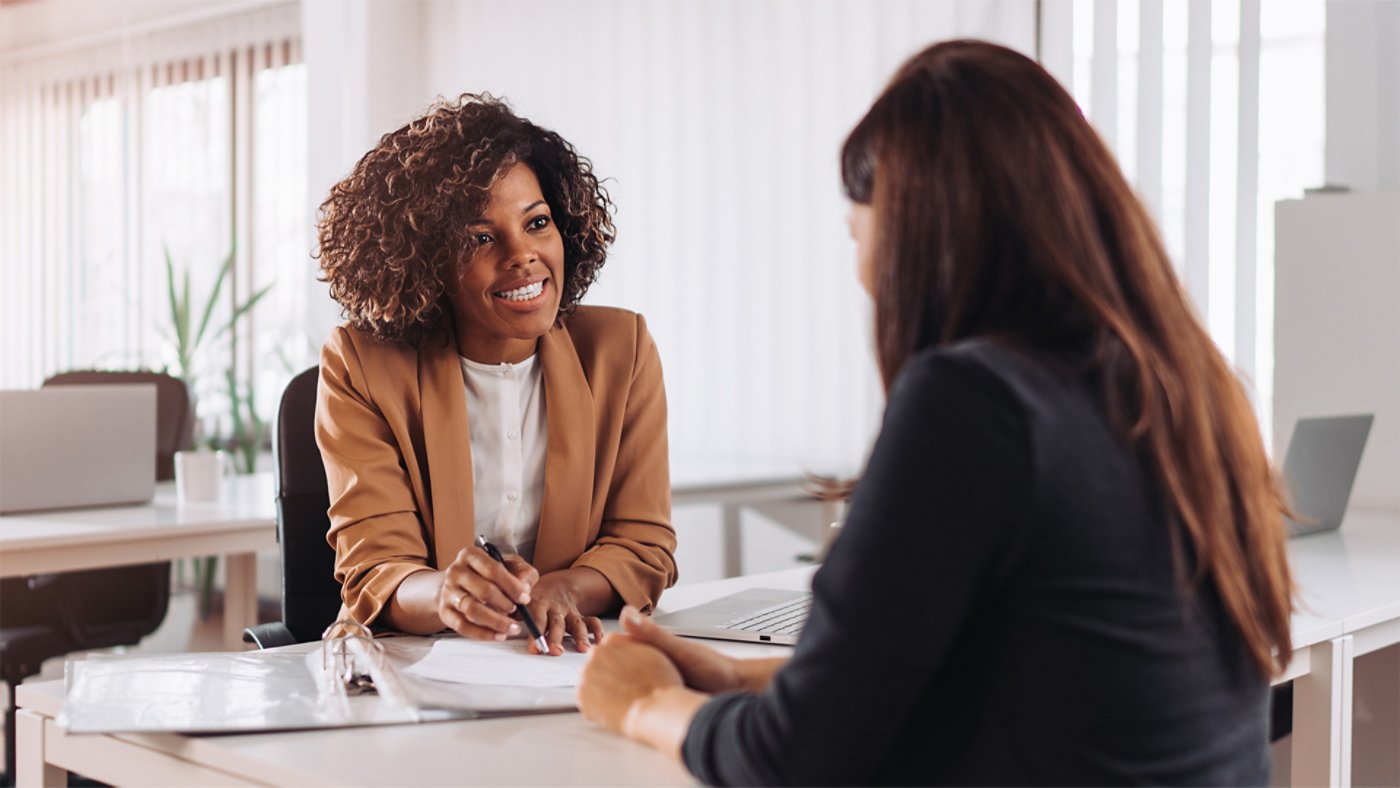 two women looking at financial plan