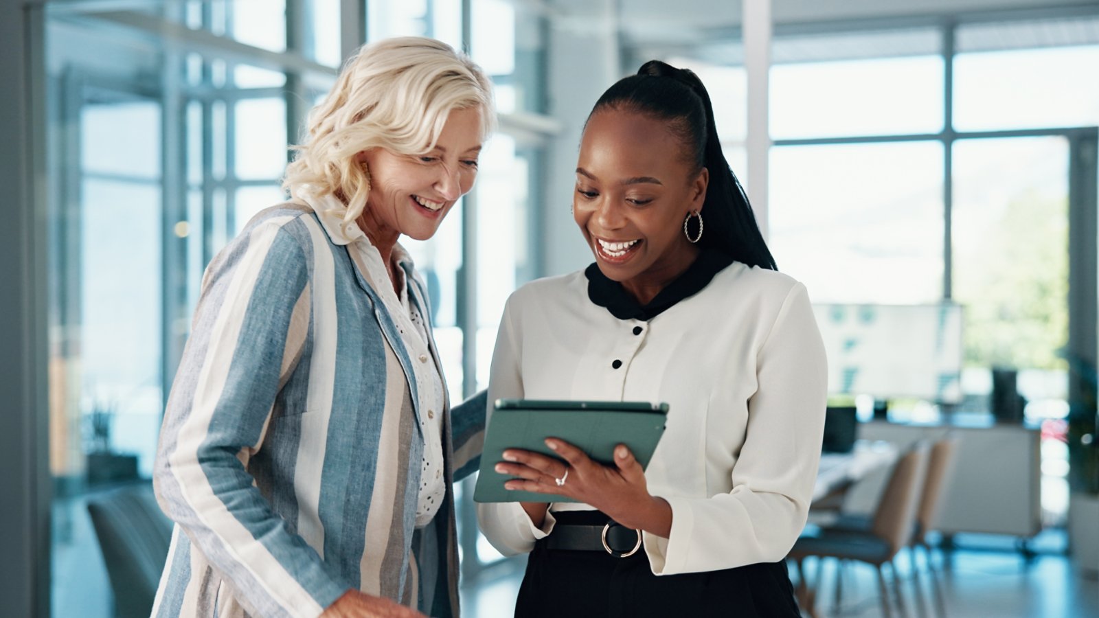 Tablet, cooperation and business people in office, conversation and email with positive feedback. Happy employees, partner and consultants with tech, teamwork and digital app for profit increase.