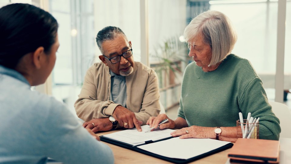 Office, lawyer or old couple with will, contract or document for retirement funding or compliance. Plan, advisor or married elderly clients with legal form or title deed agreement with life insurance.