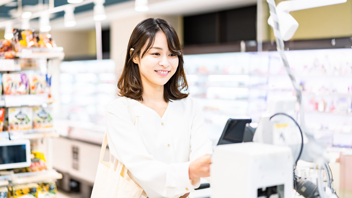 woman paying with phone