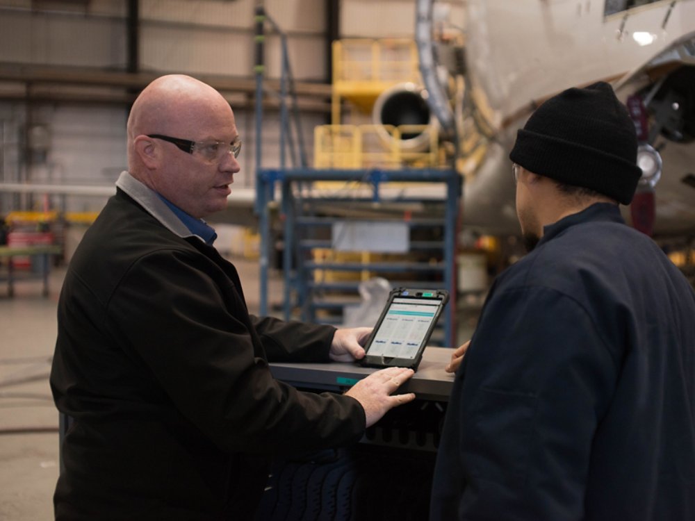 workers on mobile device