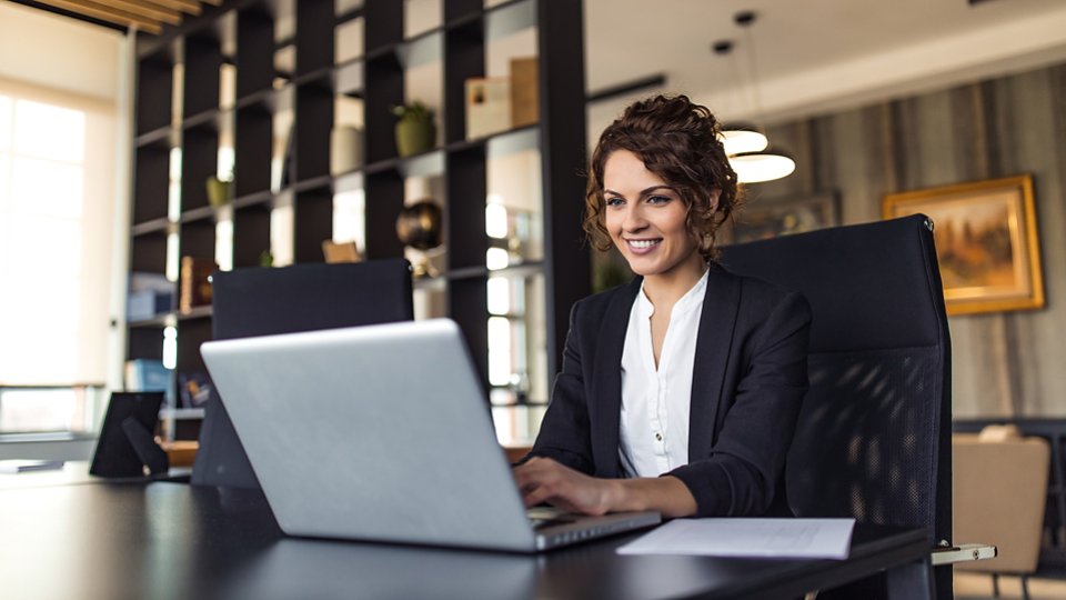 Beautiful positive executive at work, portrait.