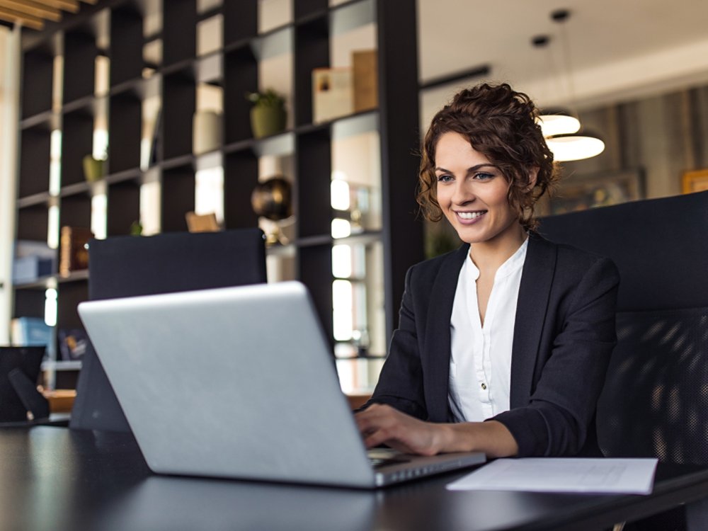 Beautiful positive executive at work, portrait.