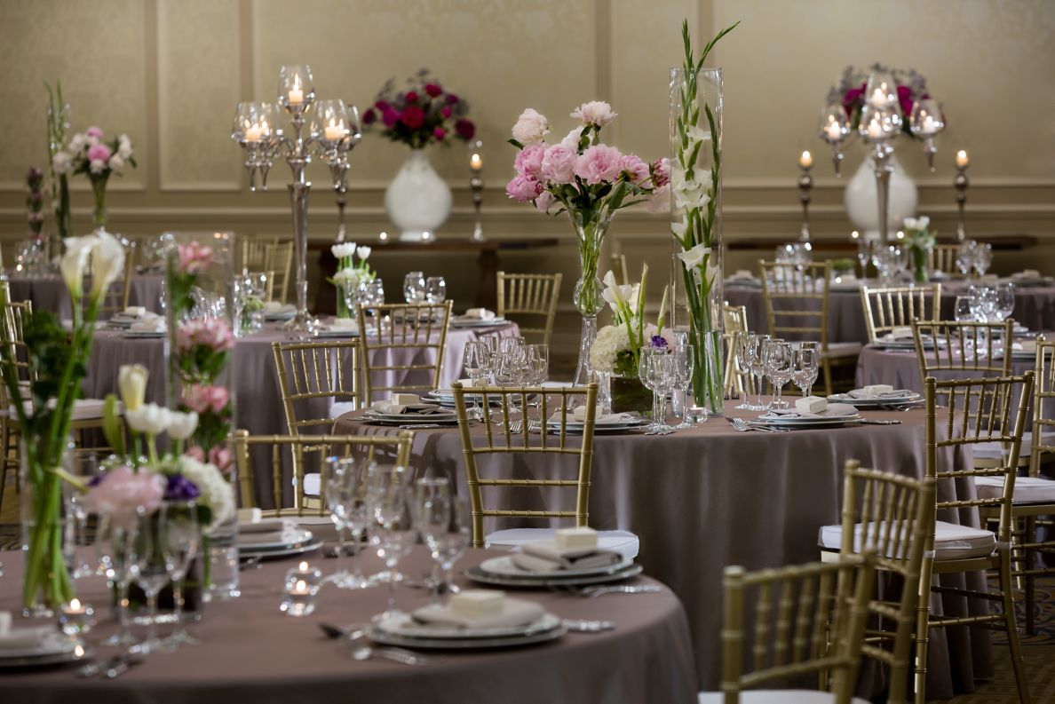 Formally set tables with candelabras and flower vases