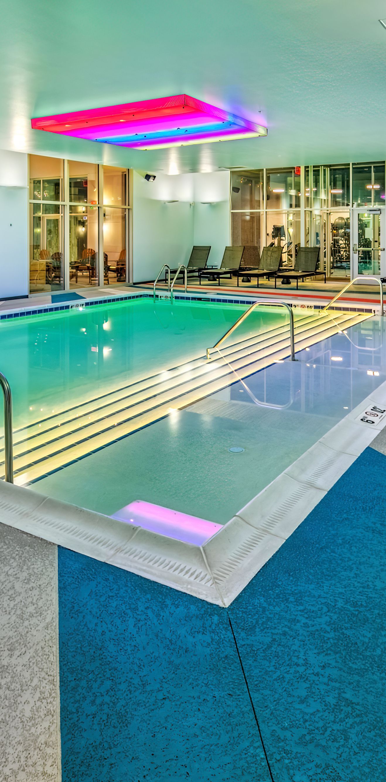 indoor pool and red chairs 
