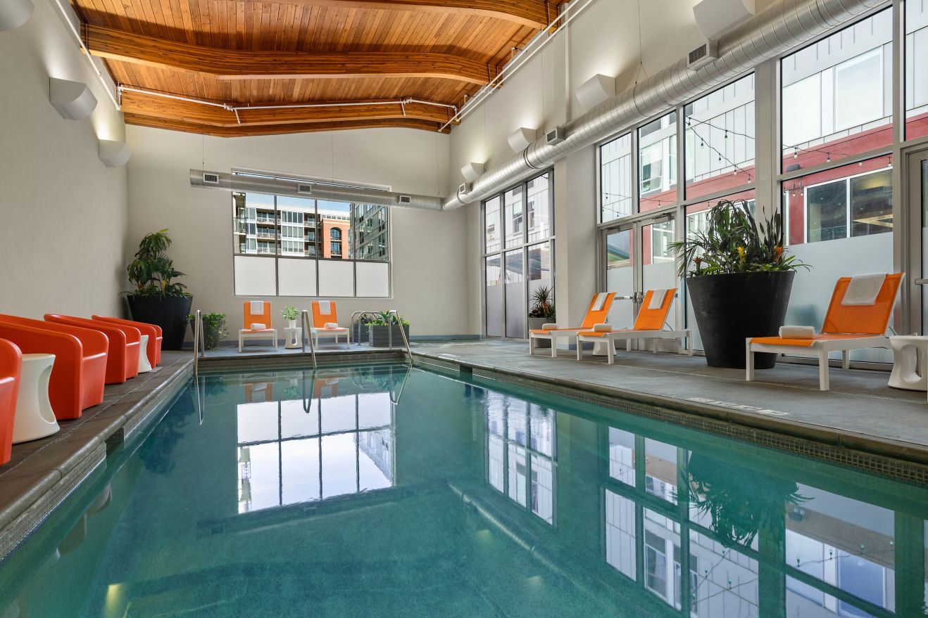 indoor pool with orange chairs