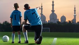 Father & Son at The Ritz-Carlton Abu Dhabi, football pitch