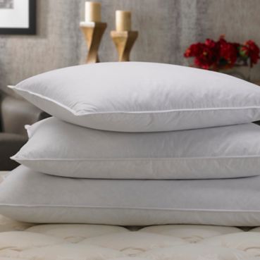 Stacked Marriott Hotels Pillows on Bed