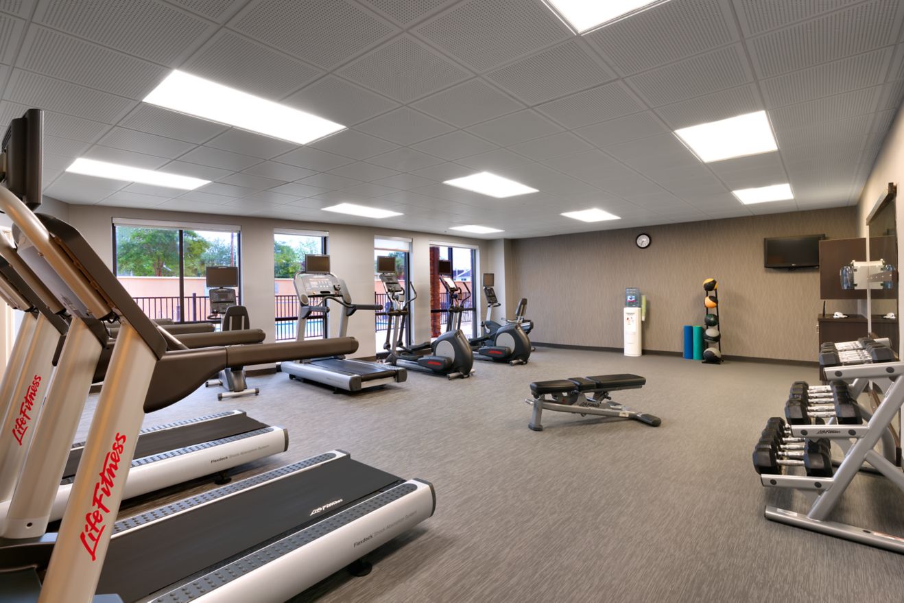 treadmills, weights, fitness room, water cooler