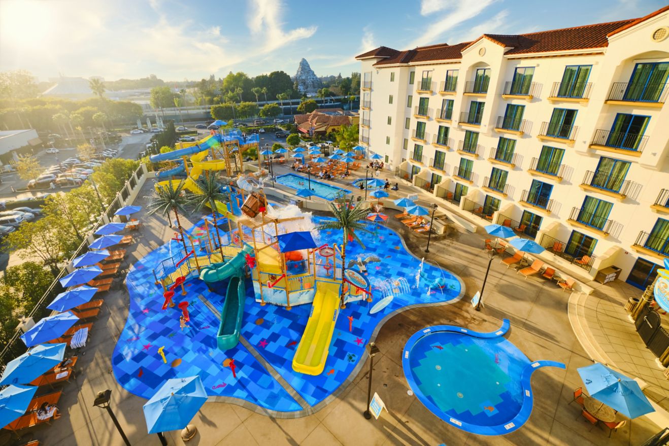 Waterpark featuring slides and splash pad next to 