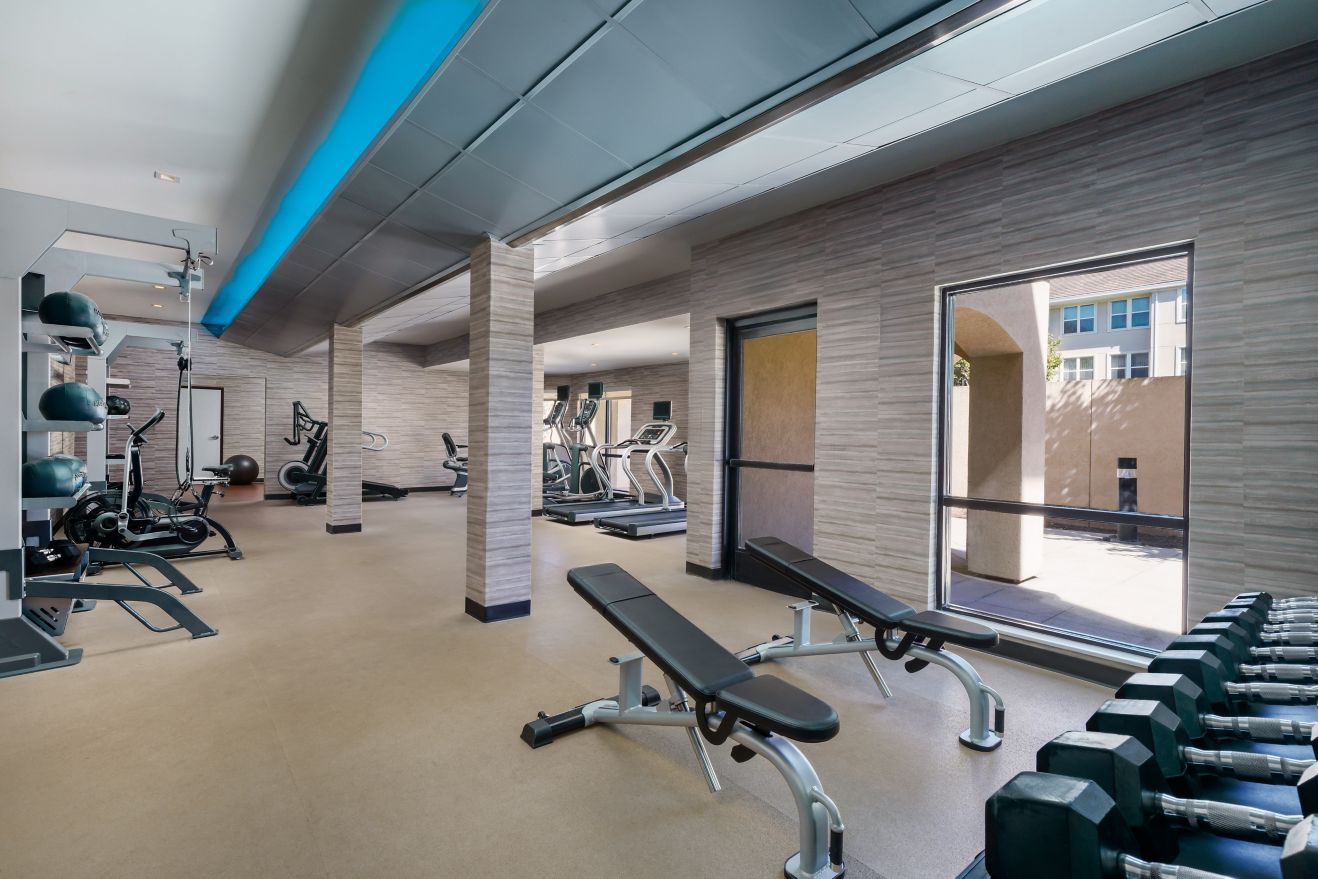 fitness area with cardio equipment and free weight